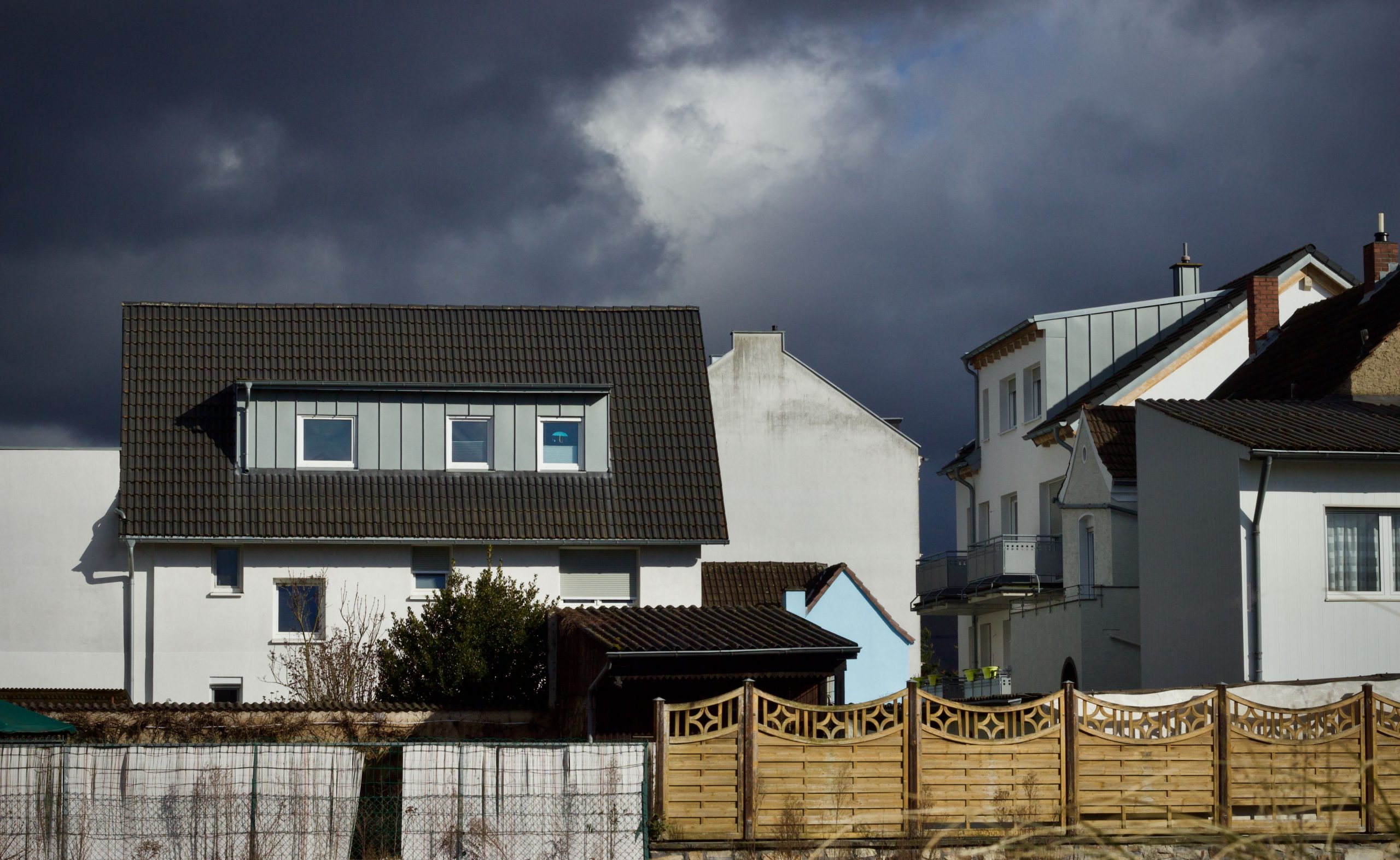 houses under gloomy skies