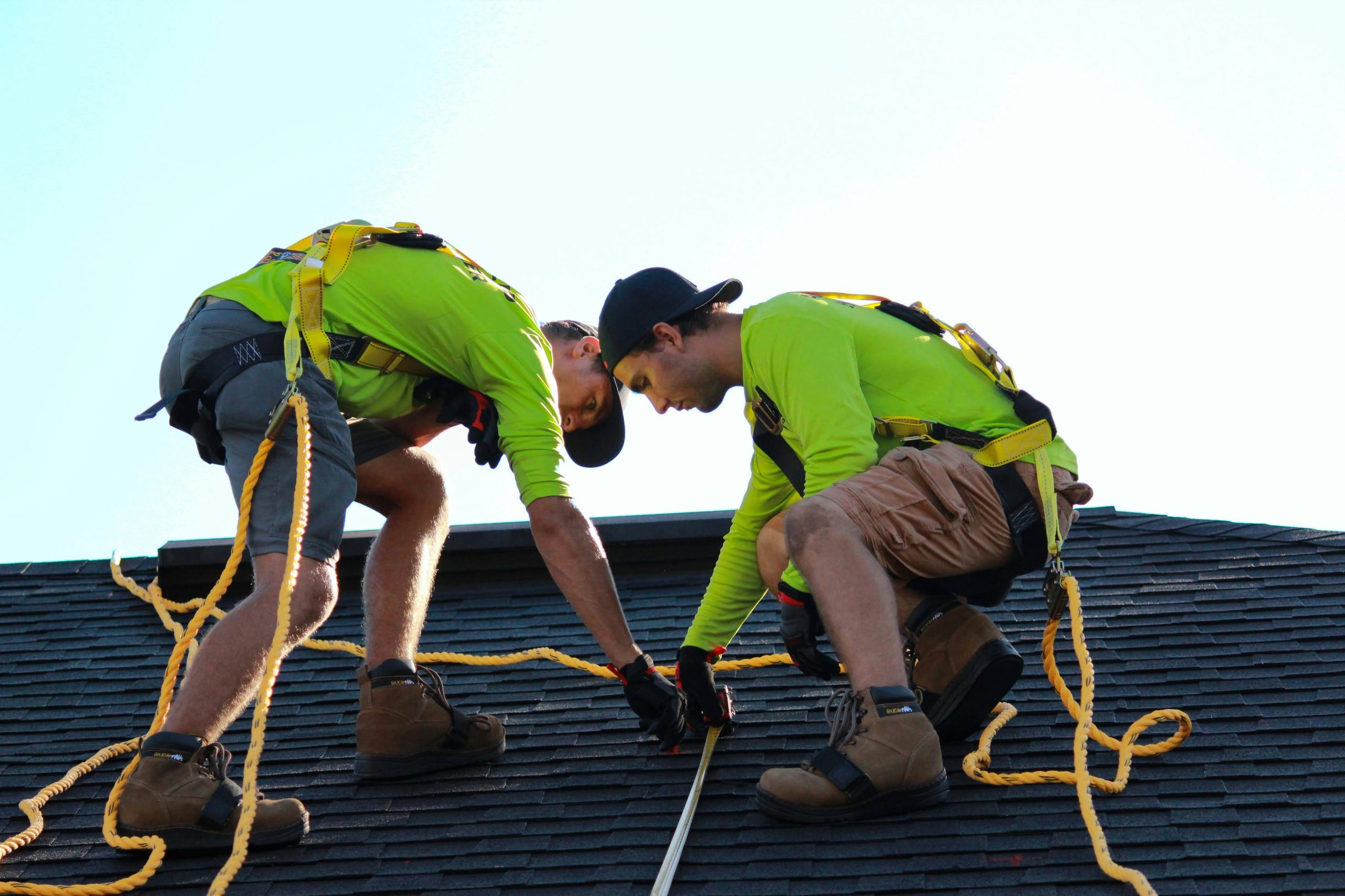 two men fixing a roof